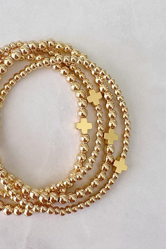 The Signature Gold Cross Collection
