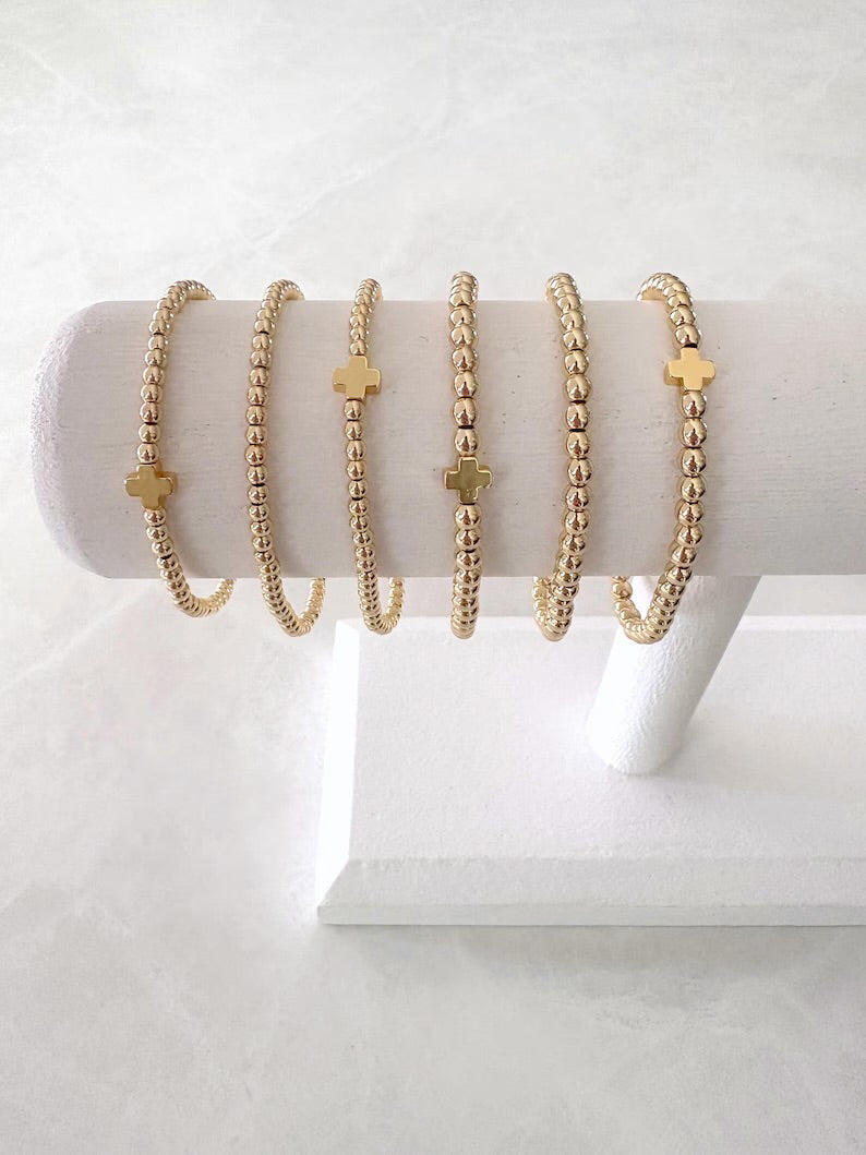 The Signature Gold Cross Collection